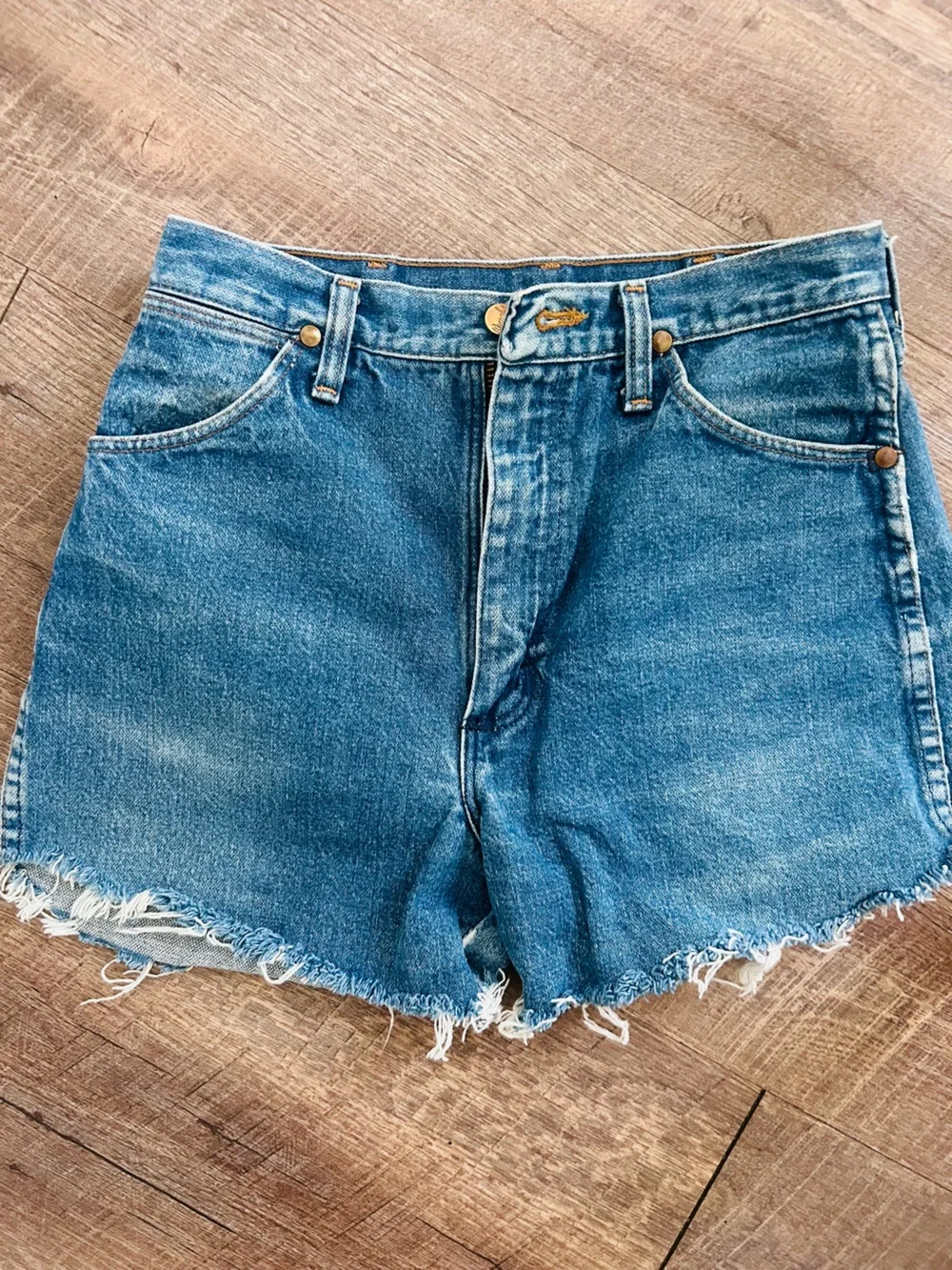 pair of vintage Wrangler high-rise cutoff denim shorts